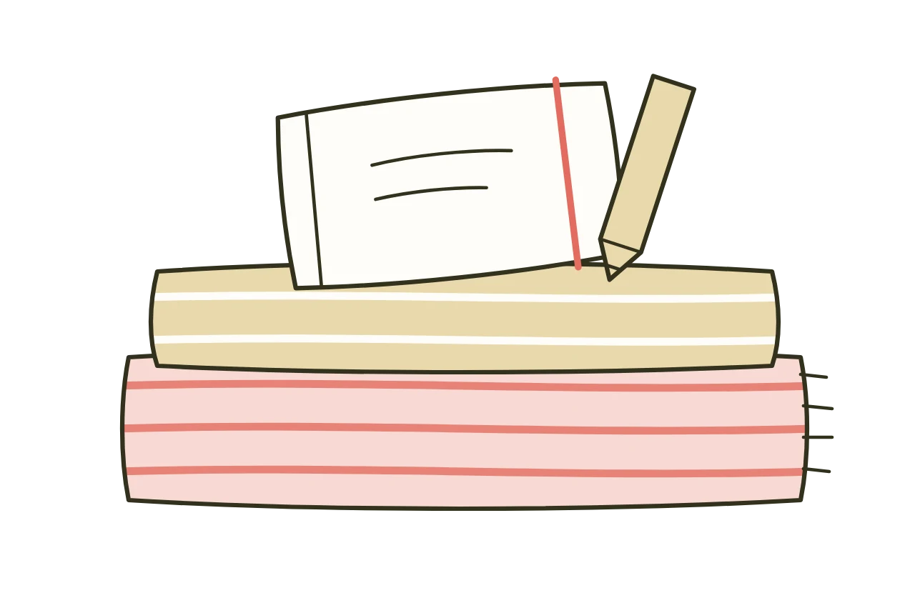Un carnet ouvert posé sur des plaids pliés